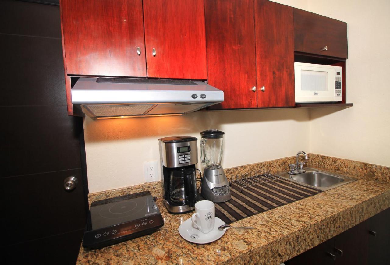 Papagayo Hotel Boutique Плая дел Кармен Екстериор снимка A coffeemaker in a kitchen